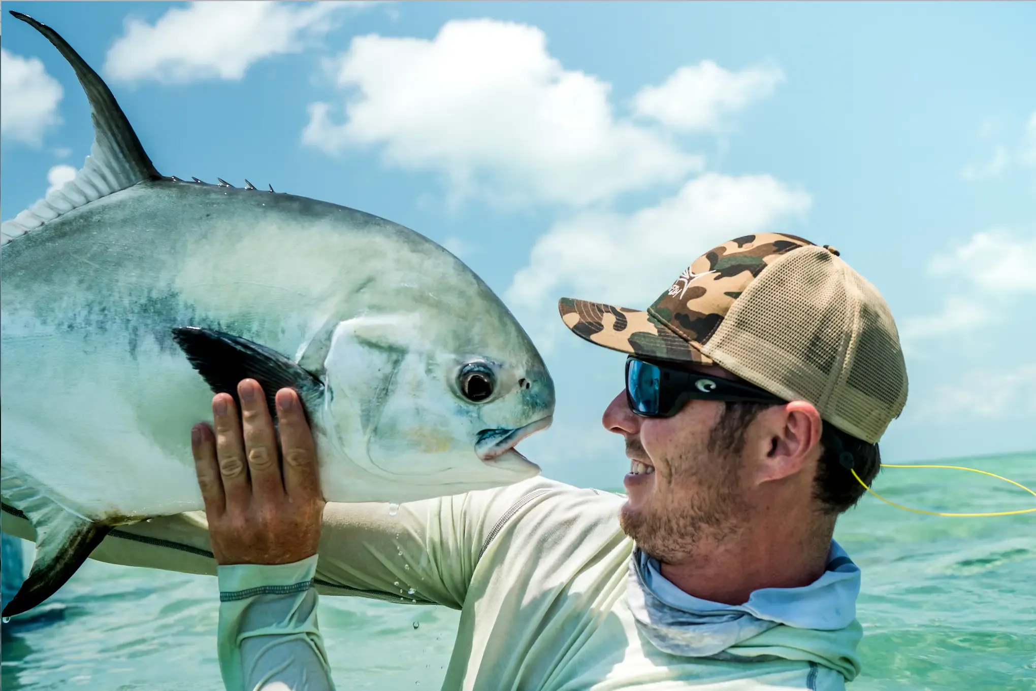 Ryan Cole reviewing charts with an angler before a day on the water in Belize