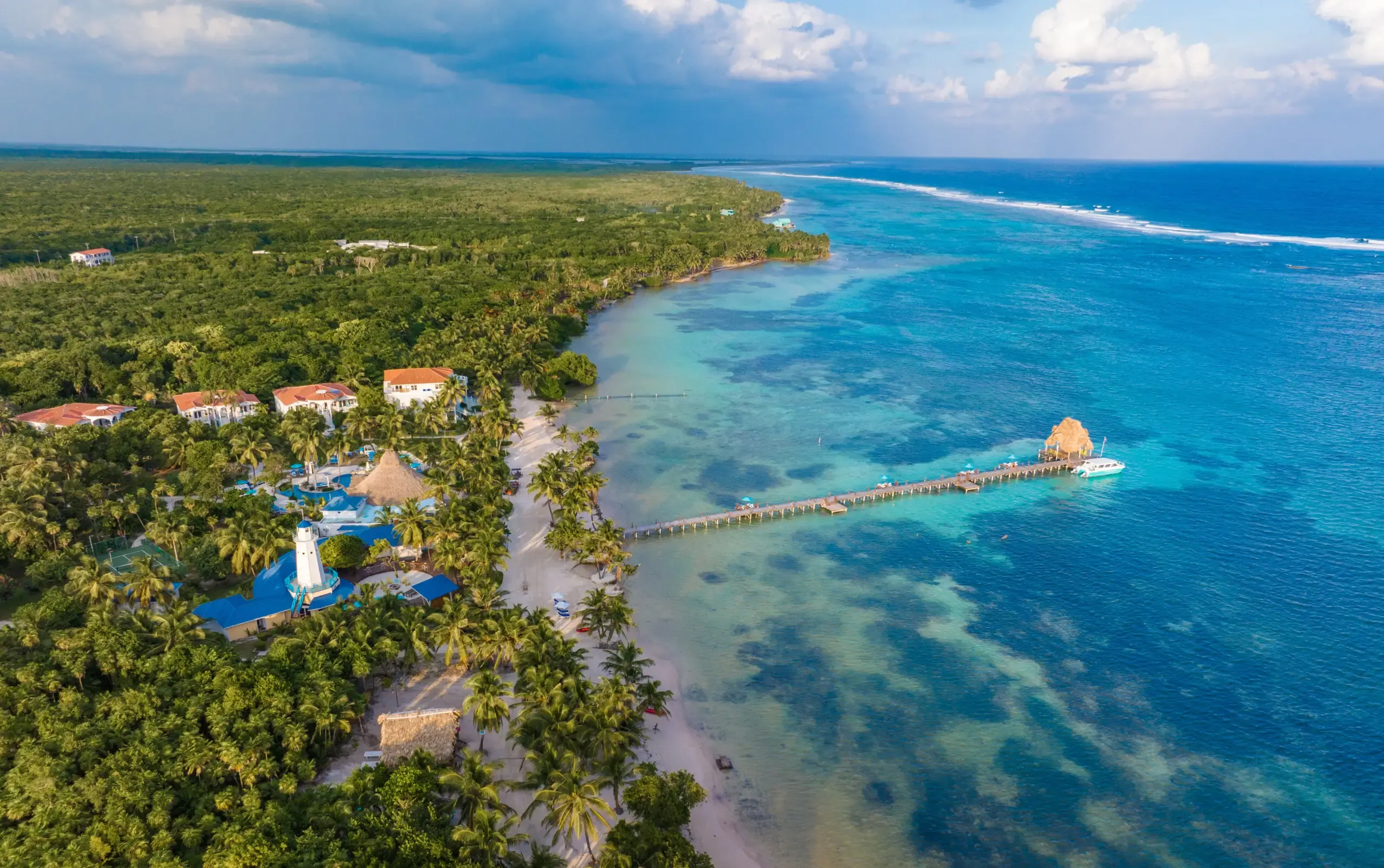 Aerial view of San Pedro, Ambergris Caye, Belize — showing the flats to the west and the barrier reef to the east